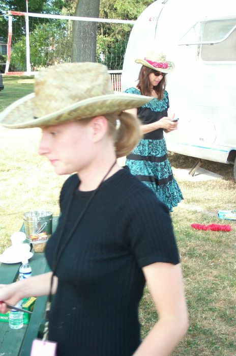 Two Pretty Girls; Each In A Straw Hat; One Going This Way; One Going That